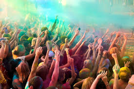 lots of hands in the air at a festival of paint