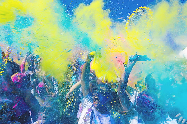 colourful paint being thrown on a group of people