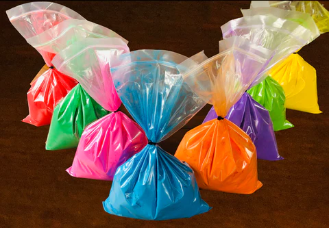 bags of powder paint in different colours