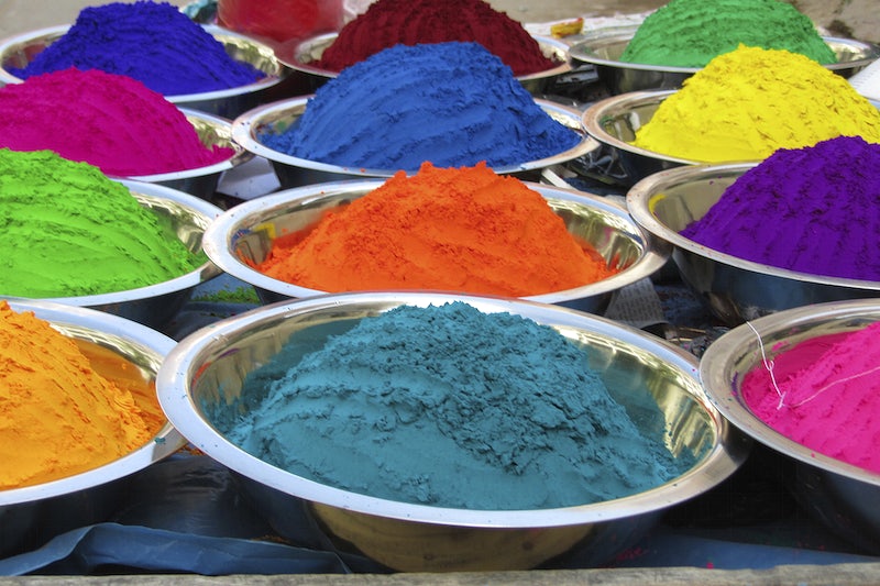 metal bowls with different colours of powder paint in